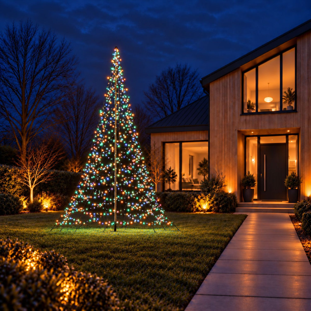 Fairybell Premium 4 metre 1536 LED in multicolour mode in the front garden of a modern timber house in the evening