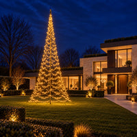 Fairybell Premium 10 metre 2048 LED lit in warm white in the garden of a modern villa at dusk