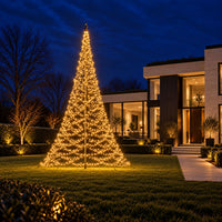 Fairybell Premium 10 metre 8000 LED lit in warm white in the garden of a modern villa at dusk